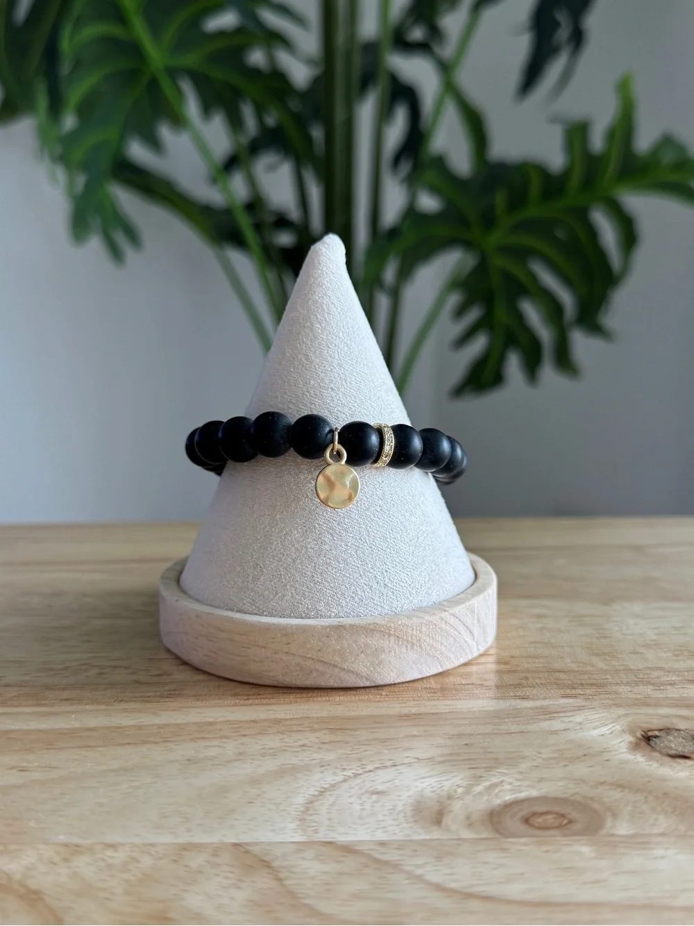 Matte Black Beaded Stretch Bracelet with Gold Charm